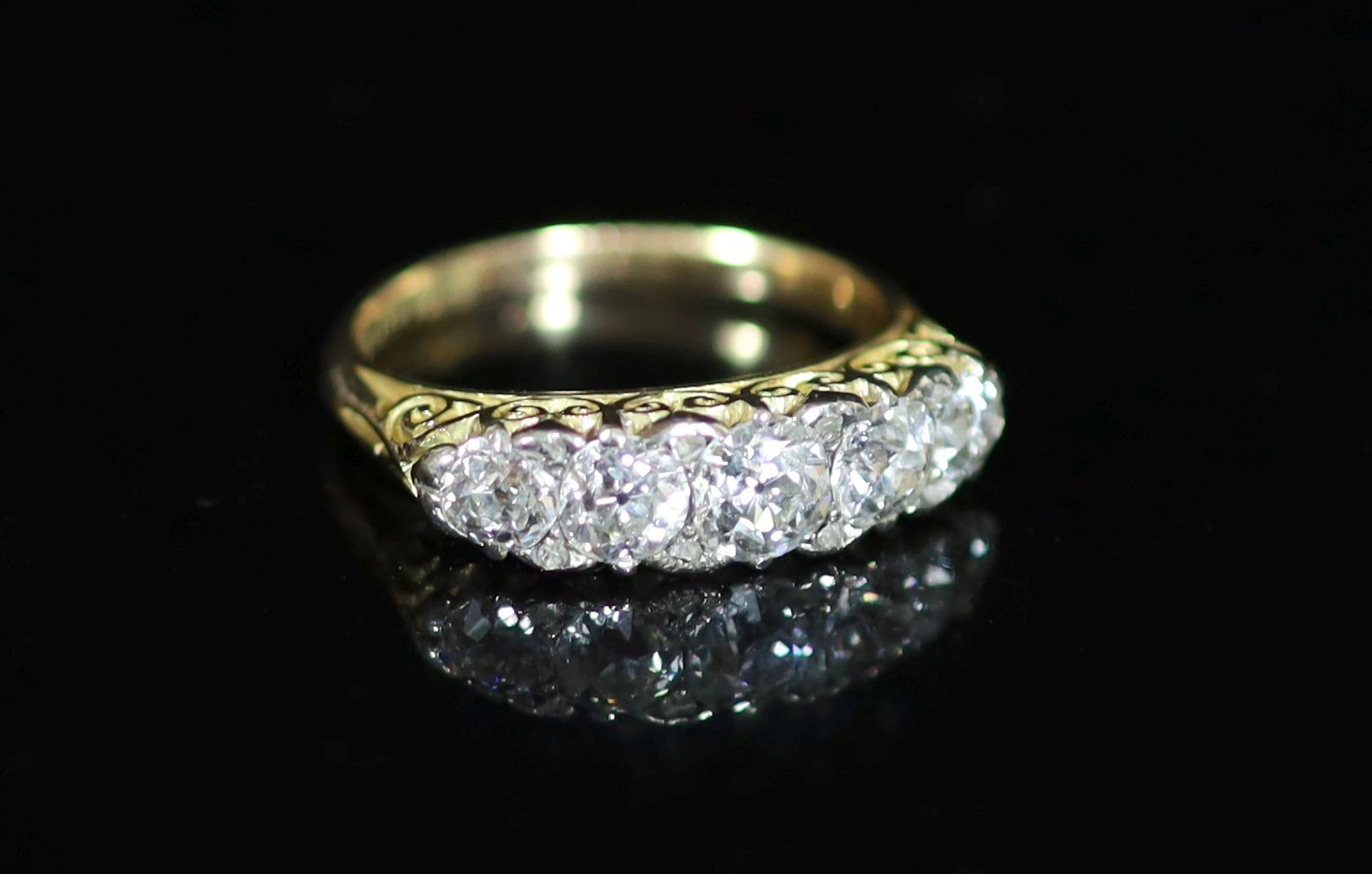 An early 20th century 18ct gold and graduated five stone diamond ring